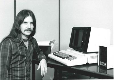 Photo: Man posing with the IBM 3101 ASCII terminal and microWAT